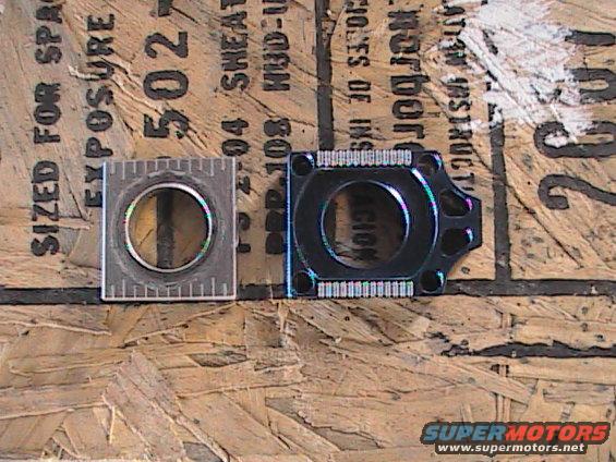 Two motorcycle parts, one with a ruler, on a wooden surface with text