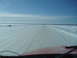 1995 Mercury Grand Marquis - Driving on a snow-covered road with cones marking the path ahead.