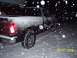 2008 Chevrolet Silverado 1500 - A black pickup truck is seen from the rear in a snowy environment, with a date stamp indicating 03/07/2008.