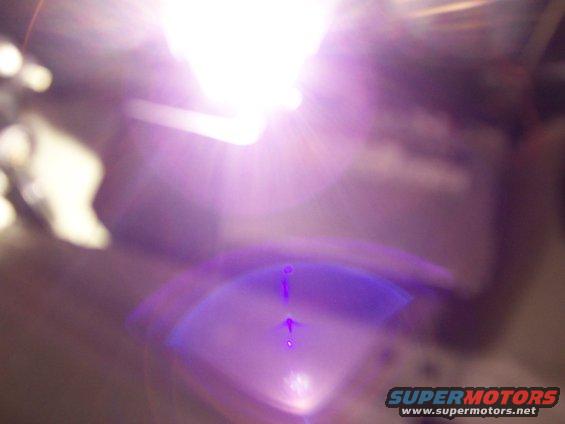 Blurry purple and white light with 'SUPERMOTORS' text