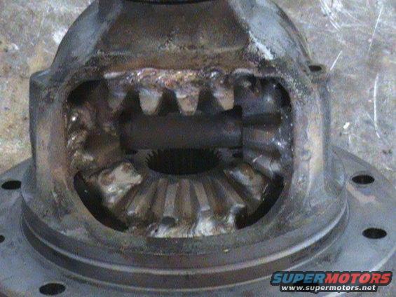Differential housing with damaged gears and visible welding marks