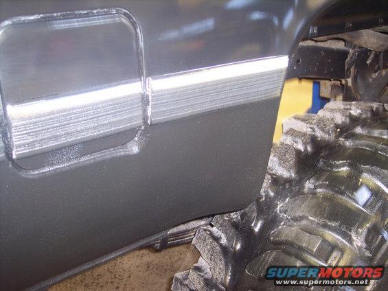 1984 GMC Sierra 3500 door trim and large off-road tire