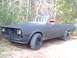 1981 Dodge Power Ram - This custom vehicle appears to be a modified pickup truck with a convertible top and a matte black finish.