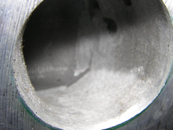 Close-up of a ported cylinder head intake port, showing internal machining