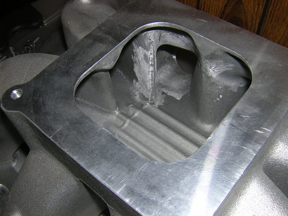 Close-up of an aluminum intake manifold with a large opening