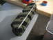 1985 Ford Crown Victoria LTD - A camouflaged valve cover sits on a workbench, possibly awaiting installation or modification.