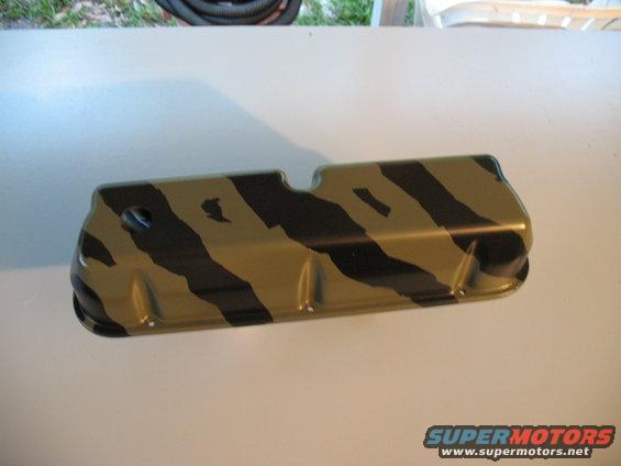 Camper van valve cover with black and tan camouflage pattern