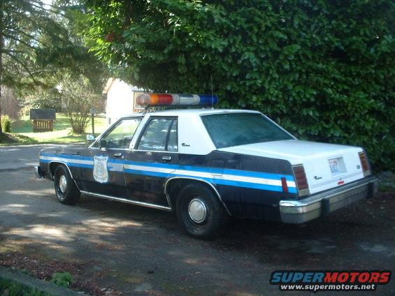 1987 Ford Crown Victoria LTD police car parked on a paved surface