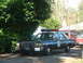 1987 Ford Crown Victoria LTD - This 1987 Ford Crown Victoria LTD police car is parked outside, with a red van visible behind it.