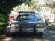 1987 Ford Crown Victoria LTD - A 1987 Ford Crown Victoria LTD police car is parked in front of other vehicles and a trailer.