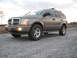 2004 Dodge Durango - This 2004 Dodge Durango is shown from a 3/4 front view on a gravel surface under an overcast sky.