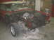 1964 Ford Galaxie - This car is in a garage with its front end disassembled and the engine removed.