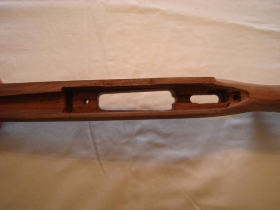 Wooden gun stock with cutouts for action and magazine