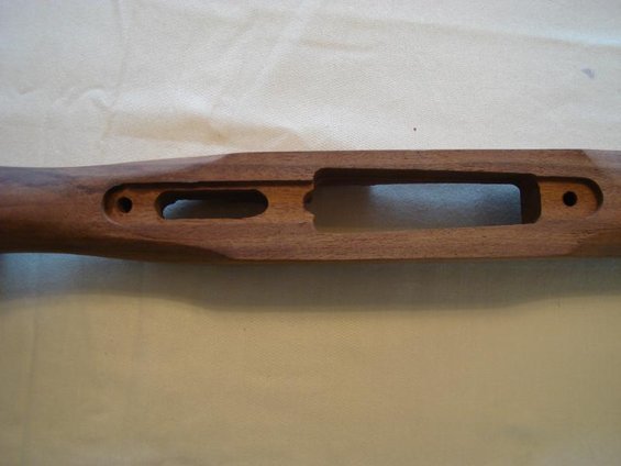 Wooden gun stock with cutouts for receiver and magazine