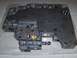 2004 Ford Crown Victoria - A metal valve body part is shown, with visible ports and fasteners.