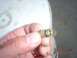 1983 Ford Bronco - A close-up shows a brass fitting with threaded ends and a black O-ring, held by a person's fingers.