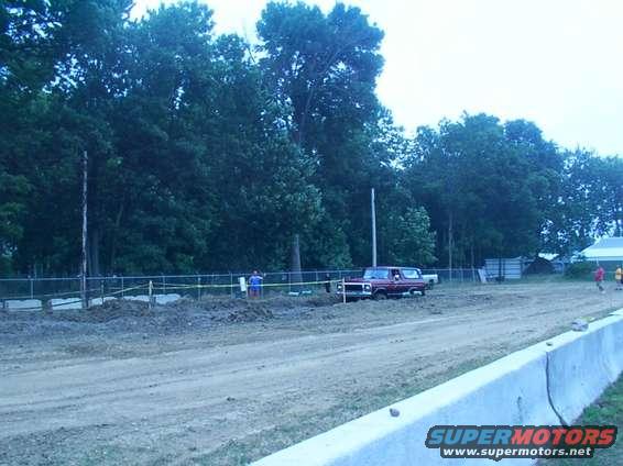 Red 1979 Ford Bronco on a dirt track