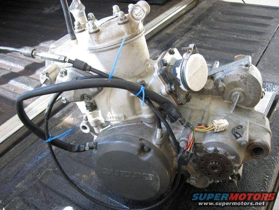 Suzuki engine with visible "SUZUKI" logo on casing