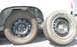1985 Ford Crown Victoria LTD - A tire on a car and a spare tire are shown side-by-side.