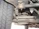 1985 Ford Crown Victoria LTD - Close-up view of the suspension system and tire of a 1985 Ford Crown Victoria LTD.