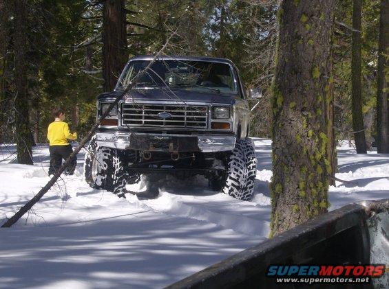 1986 Ford Bronco front view in snow with large tires