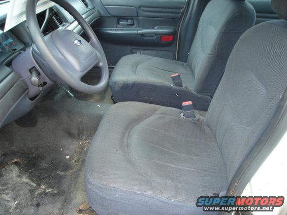 Interior view of a 2000 Ford Crown Victoria showing the steering wheel and front seats