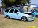 2000 Ford Expedition - This SUV has a custom paint job and large chrome wheels, sitting low to the ground.