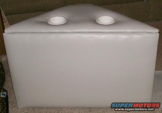 White upholstered box with two circular openings on top