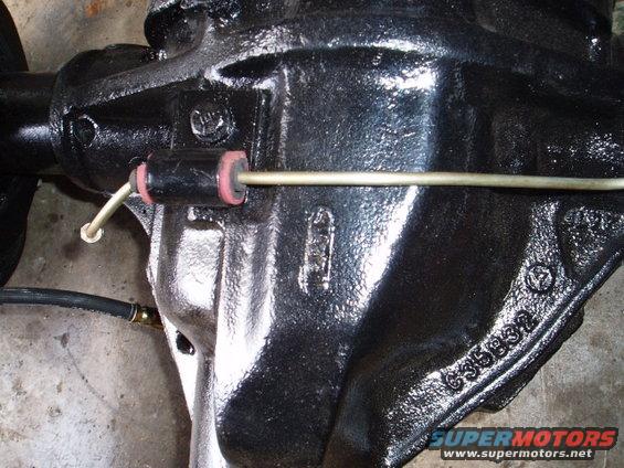 I split a vacum hose and placed it around the brake line and then split a heater hose line to go over that to secure them tightly. This sould also keep the line from rubbing any holes in it.