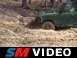 One of the trail guides shows how to churn up the mud.
