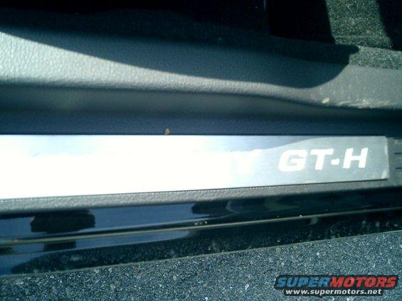Interior door sill plate showing GT-H badging on a 2007 Ford Mustang