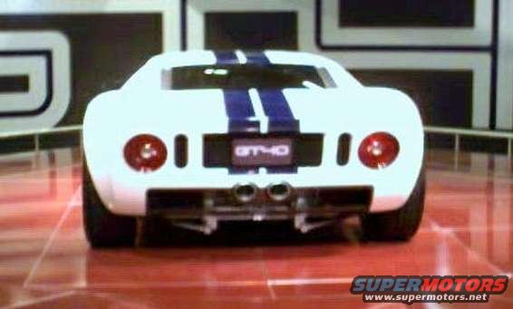 White Ford GT40 with blue stripes, rear view. GT40 badge visible
