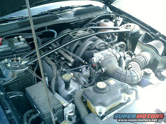 Engine bay of a 2007 Ford Mustang, showing the V8 engine and intake system