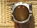 1999 Audi A4 - Close-up of an engine connecting rod, showing stamped markings and wear on the bearing surface.