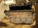 1999 Audi A4 - This engine block shows signs of rust and wear, with visible casting marks and bolt holes.