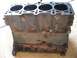 1999 Audi A4 - This is a cast iron engine block with four cylinders. It appears to be rusty.
