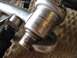 1999 Audi A4 - A close-up view of a metal fuel rail, showing stamped part numbers and manufacturing details.