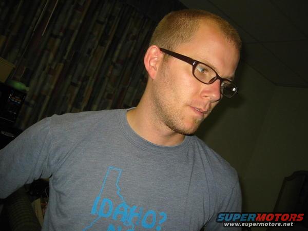 Man wearing glasses and a gray t-shirt with an Idaho graphic
