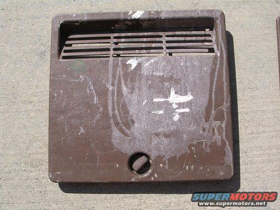 Brown vent cover with white paint splatters and a central knob