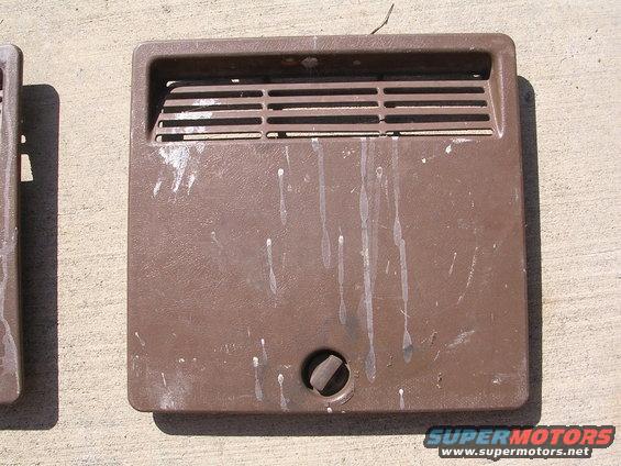 Brown plastic vent cover with horizontal slats and a central knob