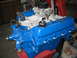 1979 Ford F-150 - A freshly painted Ford V8 engine sits on a stand, ready for installation.