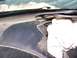 1996 Ford Probe - Close-up of a dusty car interior, showing the dashboard and a white cloth near the windshield.