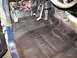 1978 Ford Bronco - Vehicle interior floor showing pedals, wiring, and black undercoating.