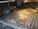 1978 Ford Bronco - The interior of a vehicle is being prepared for sound deadening material installation on the floor.