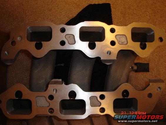 Aluminum intake manifold with four runners and bolt holes