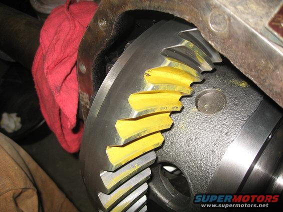 Differential gears with yellow marking compound, red shop rag nearby