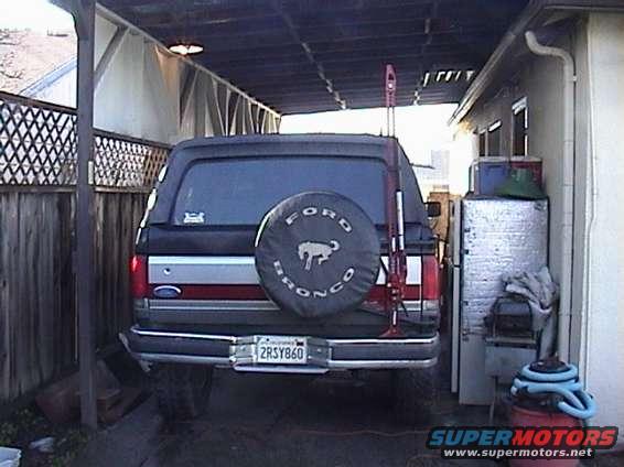 1990 Ford Bronco rear view, spare tire cover shows Ford logo and horse emblem. License plate 2RSY860
