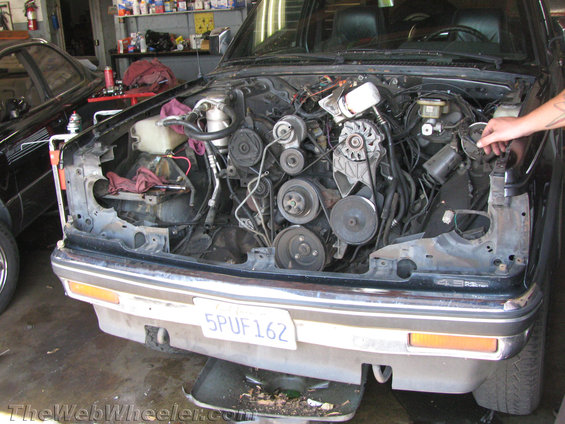 1987 Chevrolet S-10 engine bay with 4.3L V6 engine exposed. License plate 5PUF162