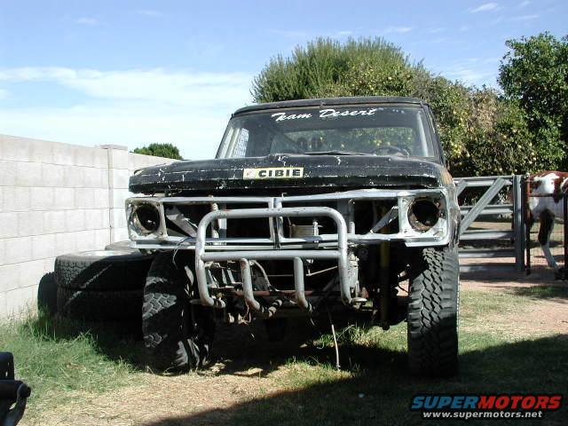 Front view of a black off-road truck with a custom bumper and 'CIBIE' sticker