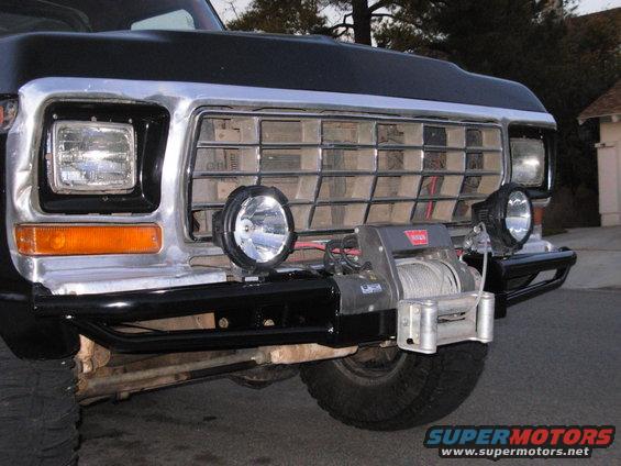 1979 Ford Bronco front end with chrome grille, square headlights, and a Warn winch mounted on a black bumper